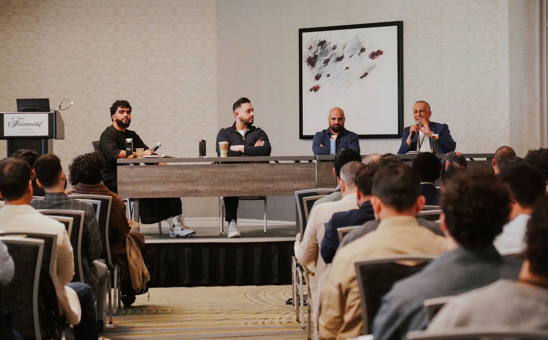 Panel discussion with an audience at the conference